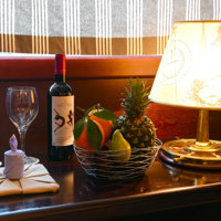 cabin service glasses and wine and fruits