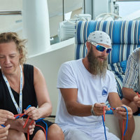 crew teaches guests to tie naval knots