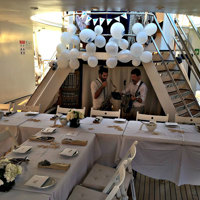 big dinner event on the deck with musicians