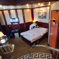 crew cabin service making the beds in a large cabin