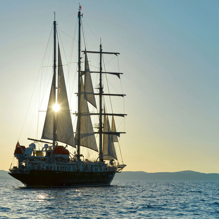 ship in the sun close to the island