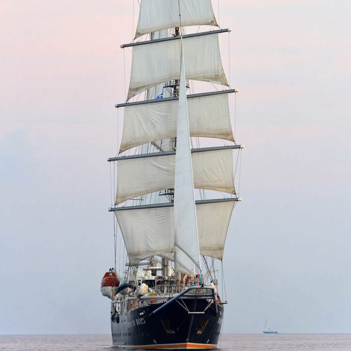 ship at sea at full sails front view